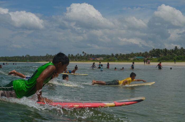 Lola-Sayong-Boy-Surfers-700x464 Learning to surf, minding the school